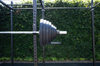 Muscle Power Olympische Halterschijf met Handgrepen - Rubber - 25 kg - In gebruik